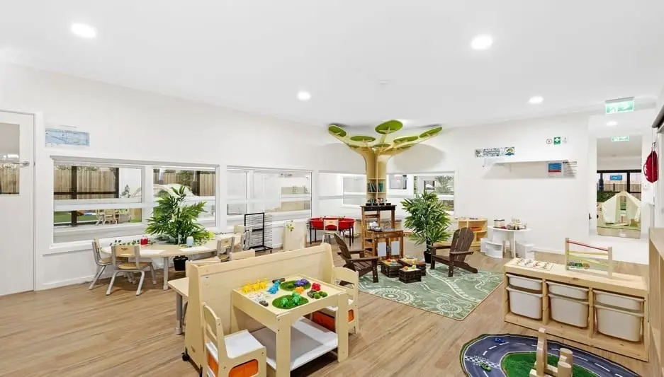 An open-plan classroom at Hoppers Crossing with inviting tables, shelves, and calm play areas.